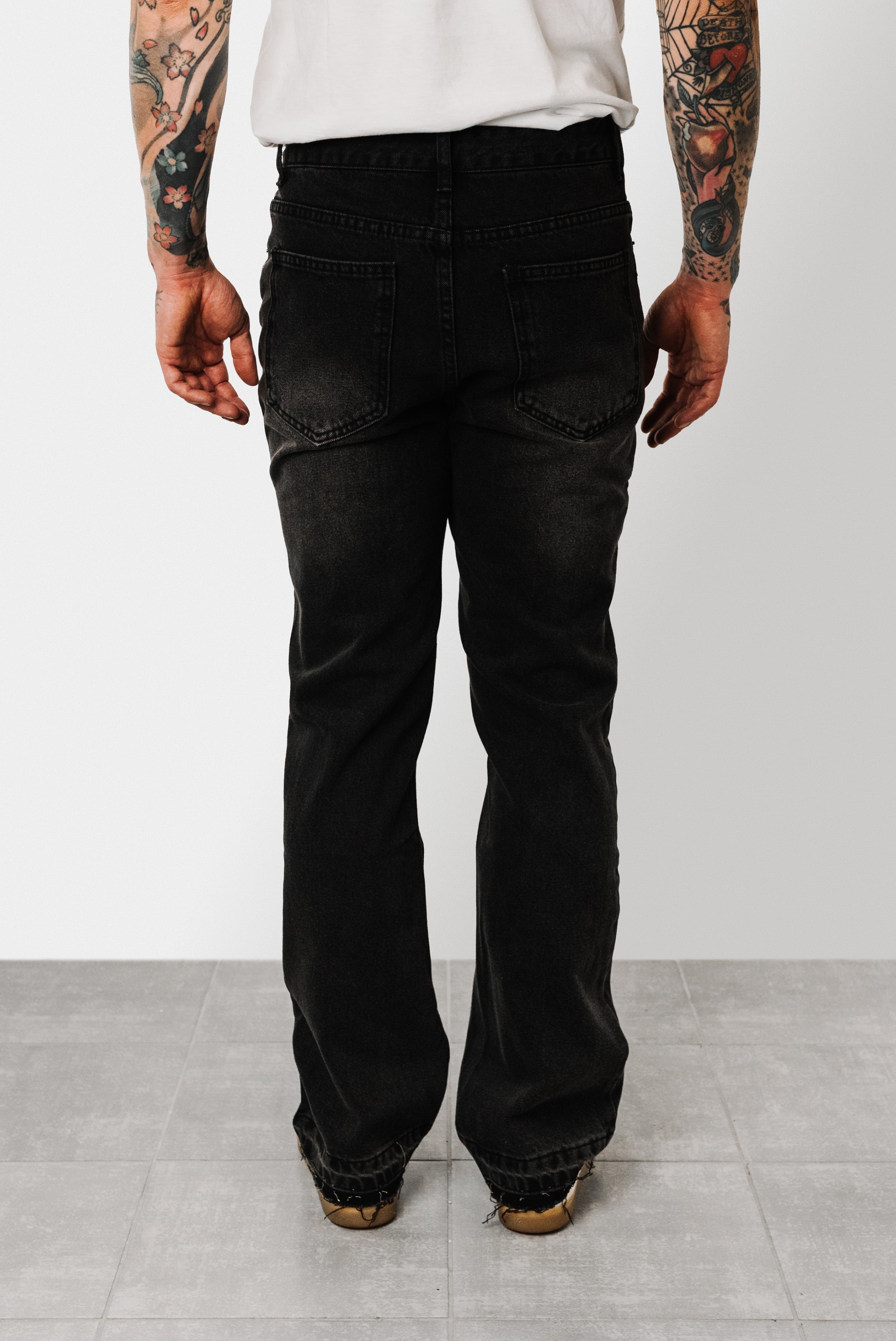 TORN AT THE BOTTOM BLACK JEANS - Shoebuya Design